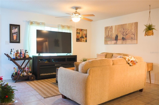 living room with ceiling fan and tile patterned flooring