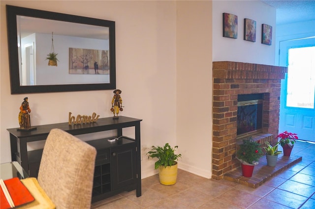 tiled living room with a fireplace