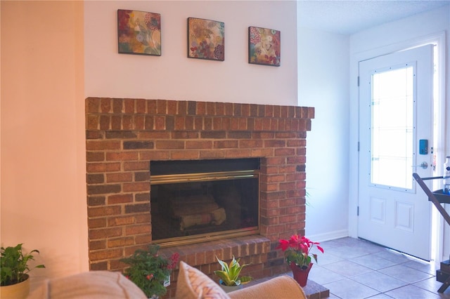 living room with light tile patterned flooring and a fireplace