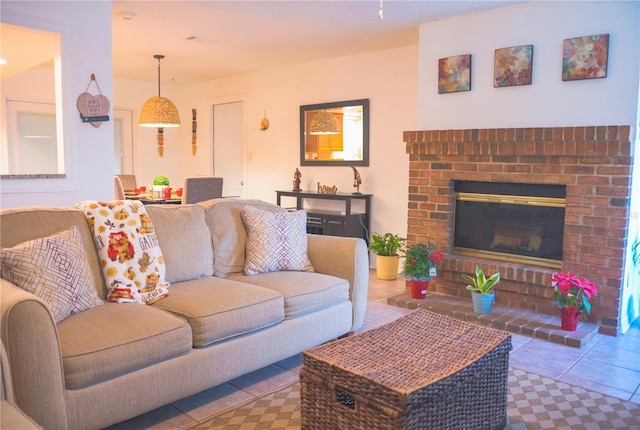 tiled living room with a brick fireplace