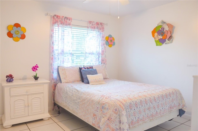 bedroom with light tile patterned floors