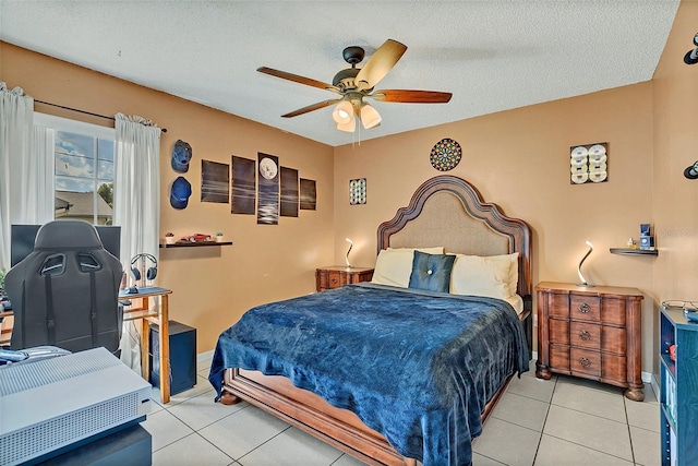 tiled bedroom featuring ceiling fan and a textured ceiling