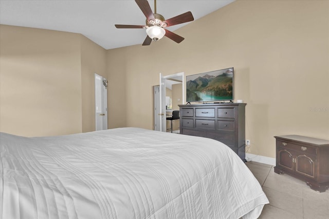 tiled bedroom featuring ceiling fan