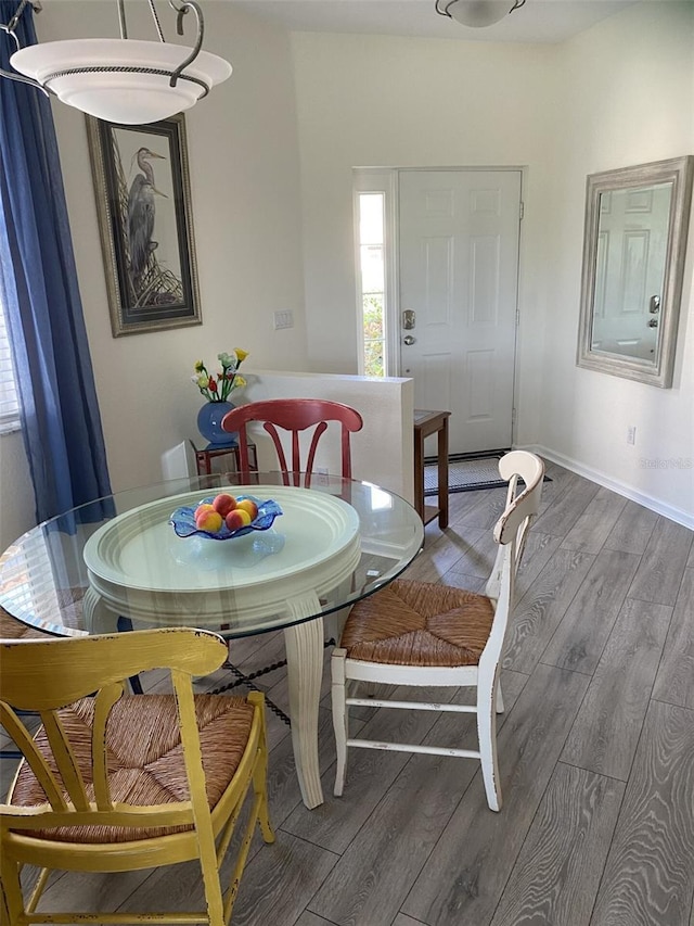 dining area featuring hardwood / wood-style flooring