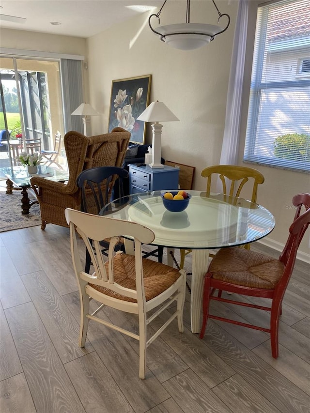 dining area with light hardwood / wood-style flooring