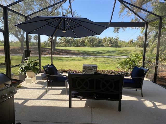 view of patio / terrace with area for grilling and glass enclosure