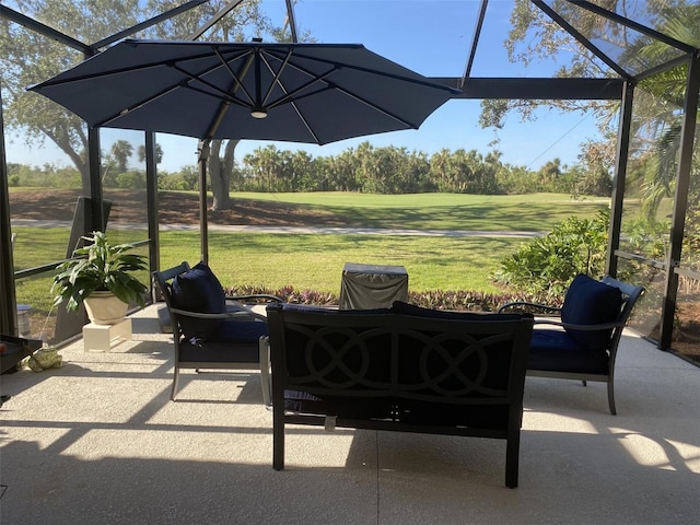 view of patio / terrace with a lanai