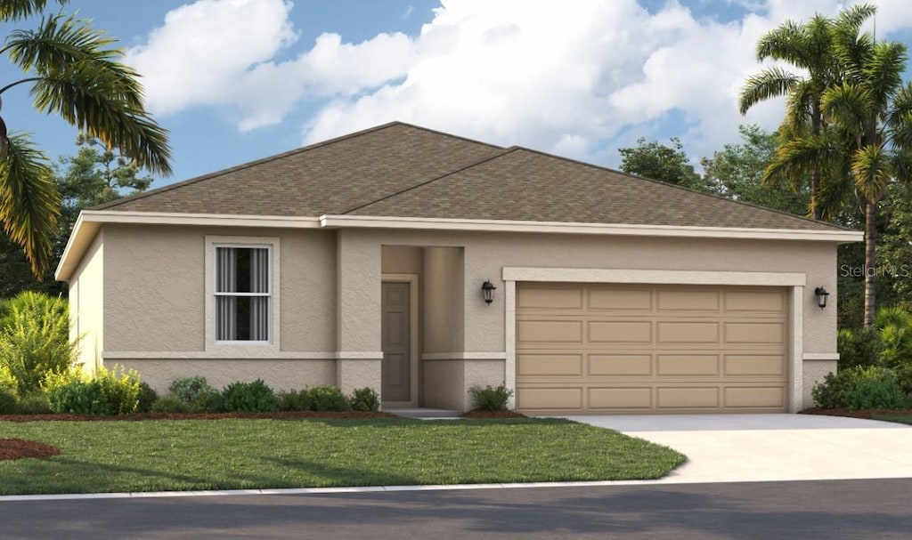 view of front of home featuring a garage and a front yard