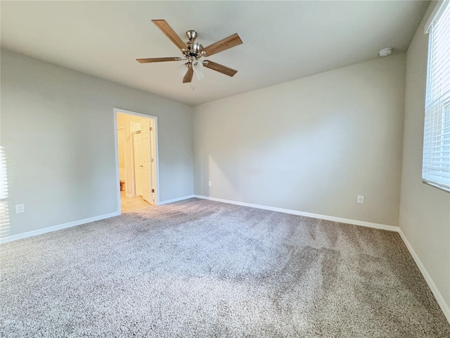 carpeted empty room with ceiling fan