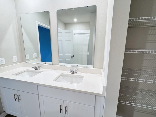 bathroom with vanity and walk in shower