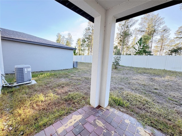 view of yard featuring central AC