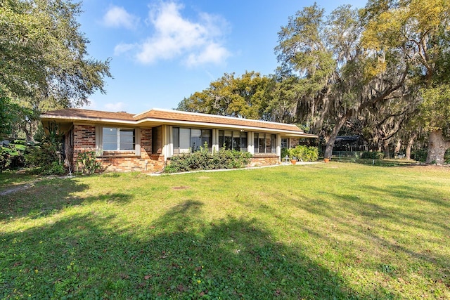 ranch-style house with a front lawn