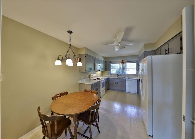 dining room with sink and ceiling fan