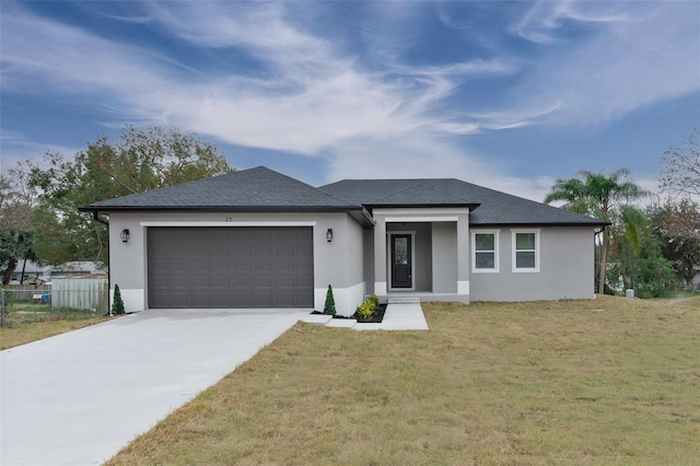 view of front of house with a garage and a front yard