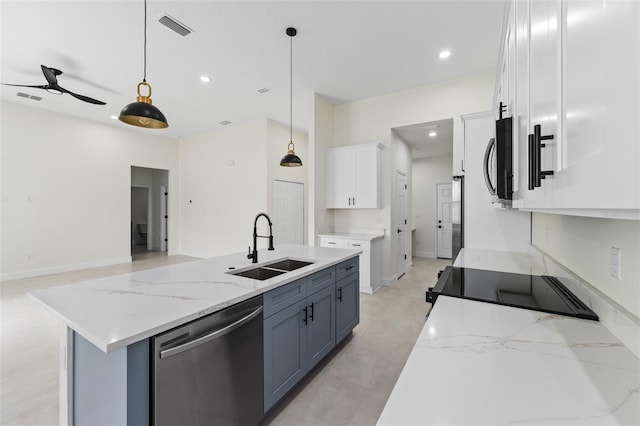 kitchen featuring sink, decorative light fixtures, an island with sink, stainless steel appliances, and white cabinets