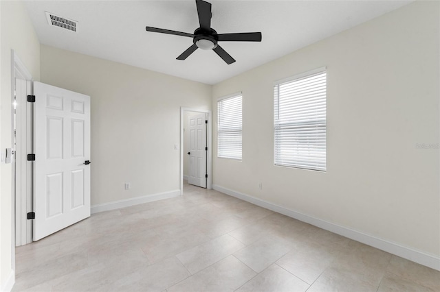 empty room featuring ceiling fan