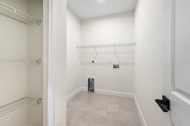 laundry room featuring hookup for a gas dryer, hookup for a washing machine, hookup for an electric dryer, and light tile patterned floors