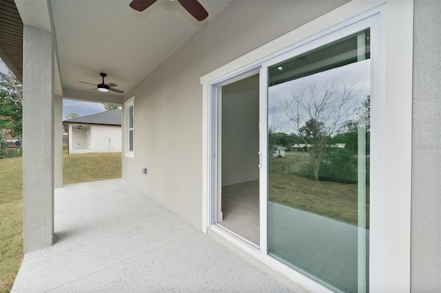 view of patio featuring ceiling fan