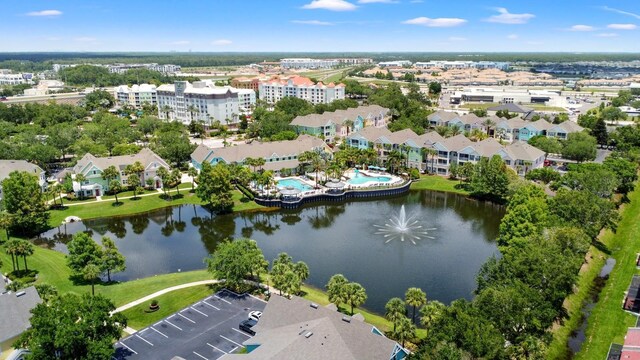 3013 Bonfire Beach Dr Unit 101, Kissimmee, FL 34746 - drone / aerial view of a nearby body of water and a pool