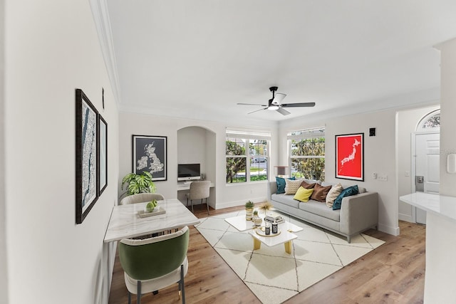 3013 Bonfire Beach Dr Unit 101, Kissimmee, FL 34746 - living area with a ceiling fan, baseboards, crown molding, and light wood finished floors