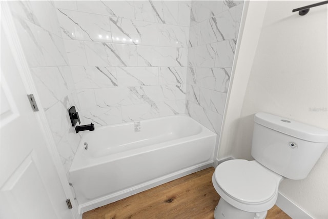 3013 Bonfire Beach Dr Unit 101, Kissimmee, FL 34746 - bathroom with wood finished floors, toilet, and tub / shower combination