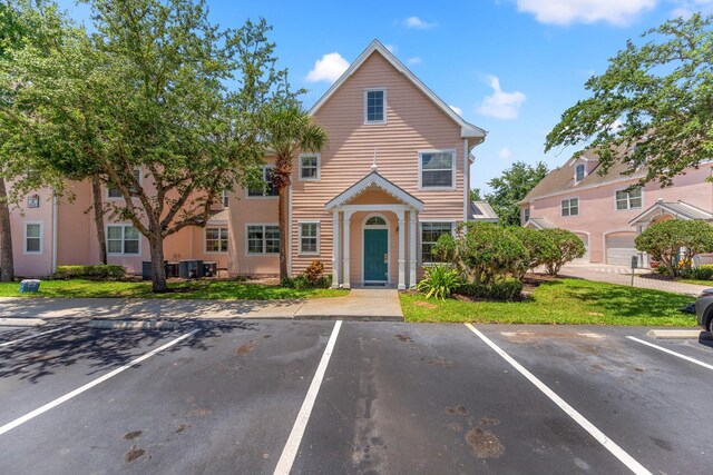 3013 Bonfire Beach Dr Unit 101, Kissimmee, FL 34746 - townhome / multi-family property with uncovered parking
