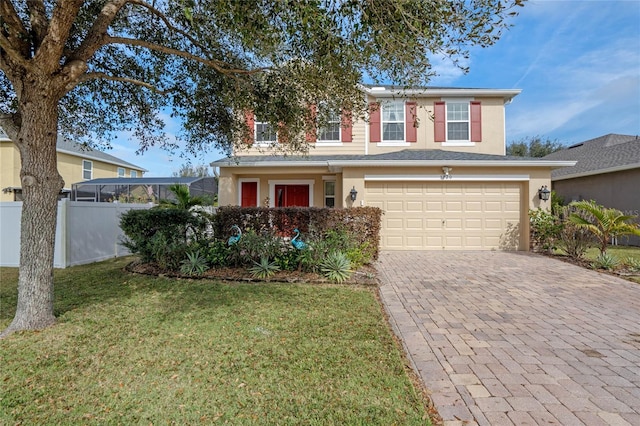 view of front of property featuring a garage and a front yard