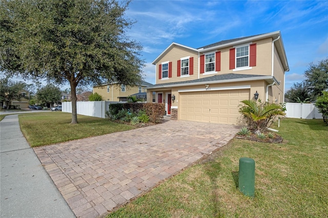 view of front of home with a garage and a front lawn