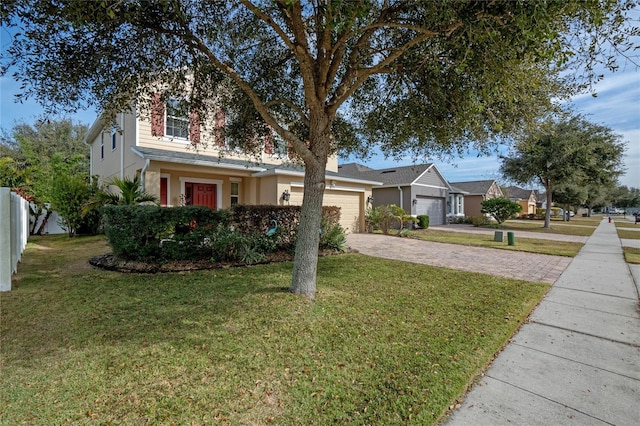 front facade with a garage and a front yard