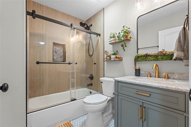 full bathroom with combined bath / shower with glass door, tile patterned flooring, vanity, a textured ceiling, and toilet