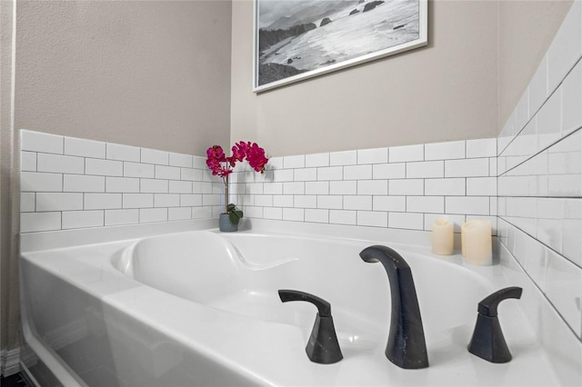 bathroom featuring a washtub