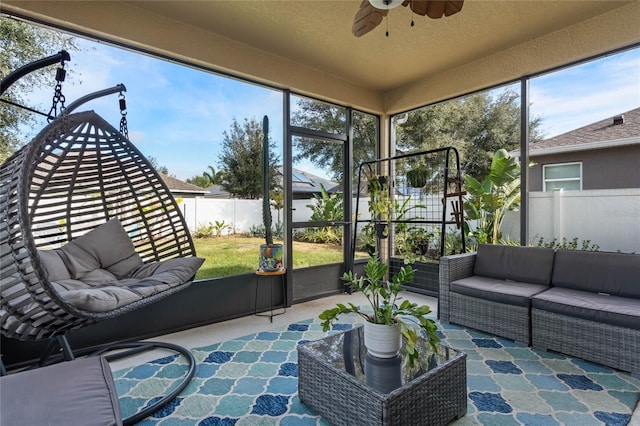 sunroom / solarium with ceiling fan