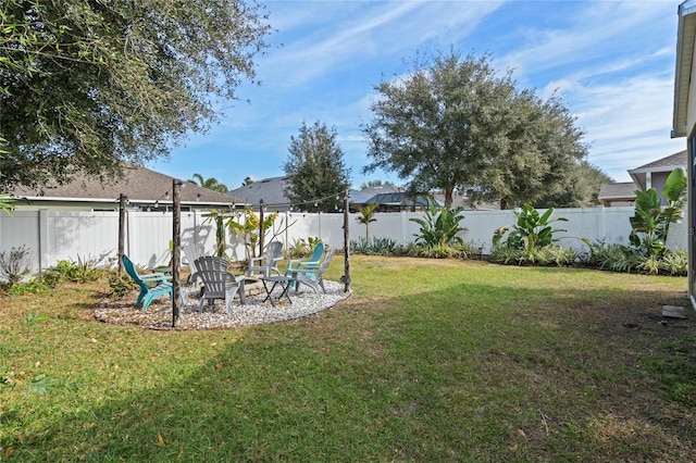 view of yard with a fire pit