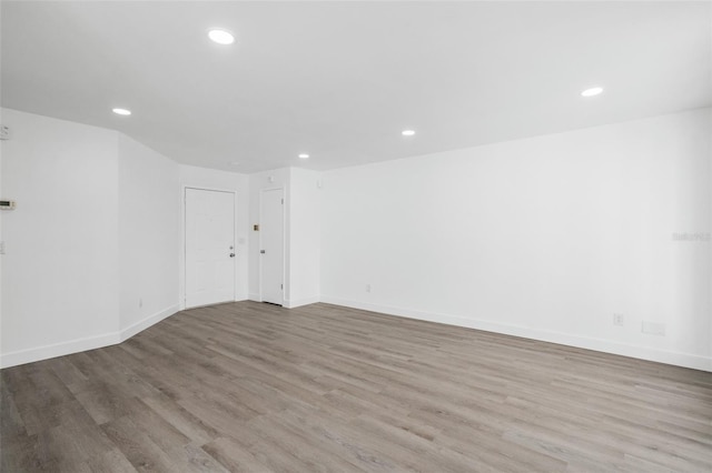 spare room featuring light wood-type flooring