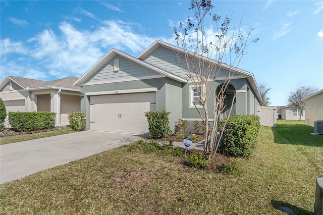 view of front of property with cooling unit, a garage, and a front lawn