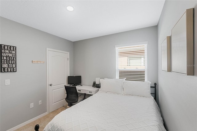 bedroom featuring light colored carpet