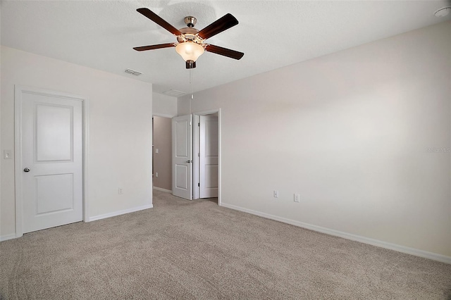 unfurnished bedroom with light carpet and ceiling fan