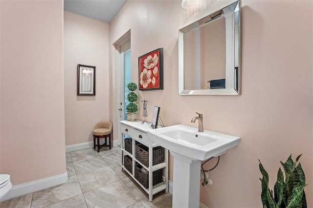 bathroom with sink and toilet