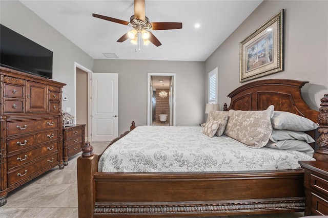 bedroom featuring ceiling fan and ensuite bathroom