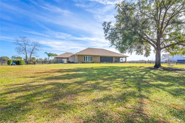 view of yard with a rural view