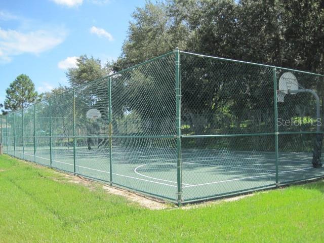 view of sport court with community basketball court and fence