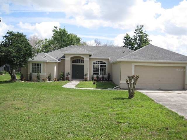 ranch-style house with driveway, a shingled roof, stucco siding, an attached garage, and a front yard