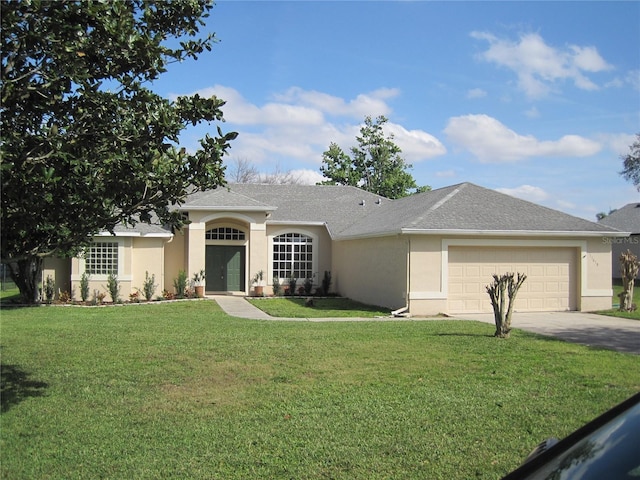 single story home featuring concrete driveway, stucco siding, roof with shingles, an attached garage, and a front yard