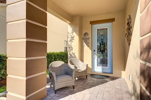 doorway to property with a patio