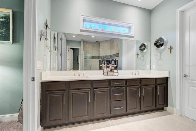 bathroom featuring tile patterned floors, vanity, and a shower with door