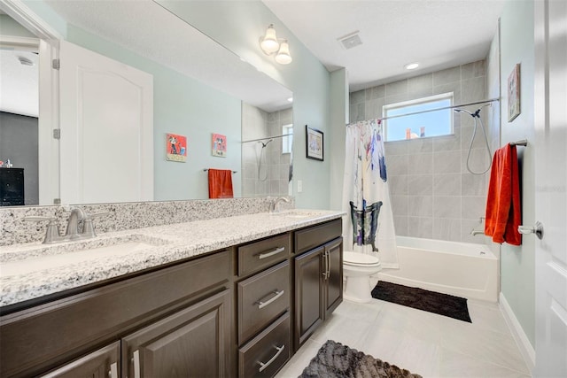 full bathroom featuring vanity, toilet, tile patterned flooring, and shower / bath combo with shower curtain