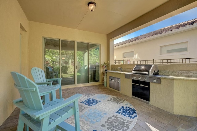 view of patio with an outdoor kitchen