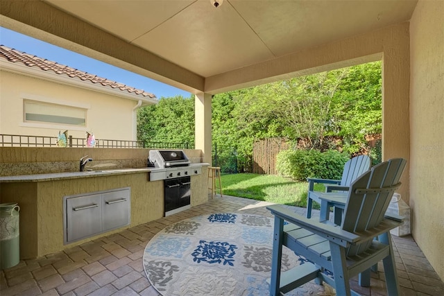 view of patio / terrace with a grill and exterior kitchen