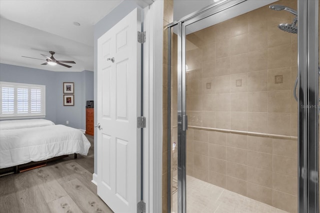 bedroom with ceiling fan and light hardwood / wood-style flooring