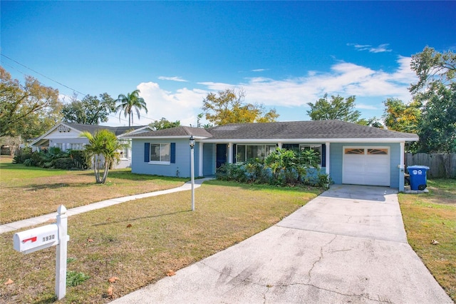 single story home with a garage and a front yard